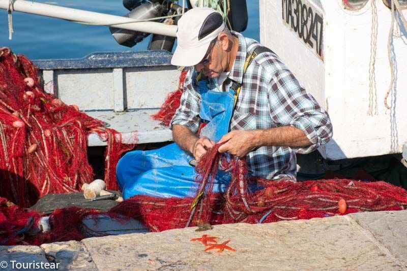 Fisherman in the port of Marseille, France