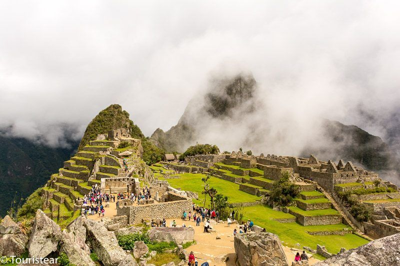 Machu Picchu with sun and fog