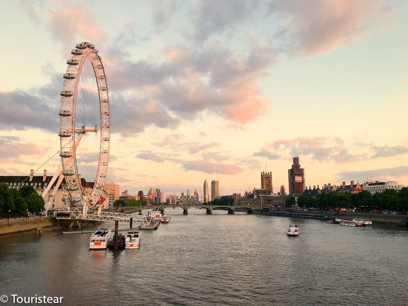 View of big ben and london eye at sunset, london