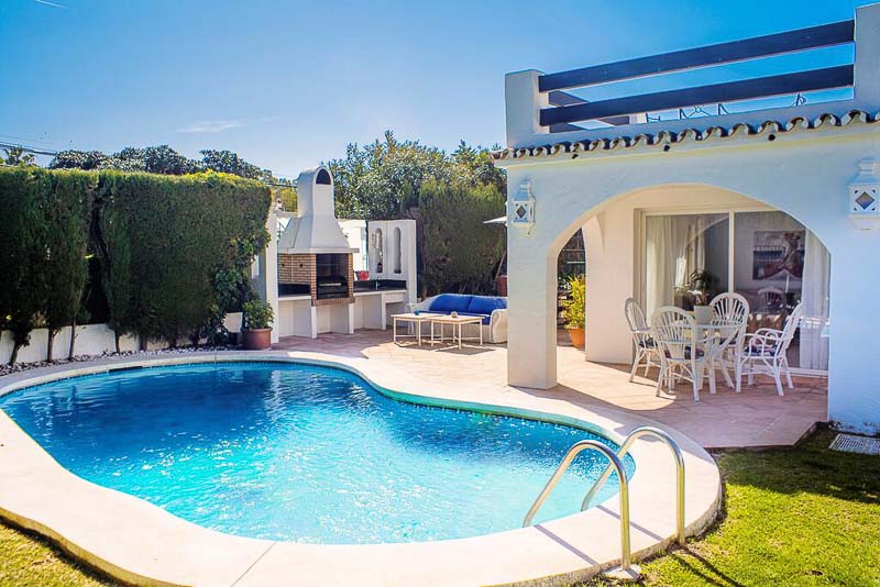 typical Andalusian backyard with pool and bbq