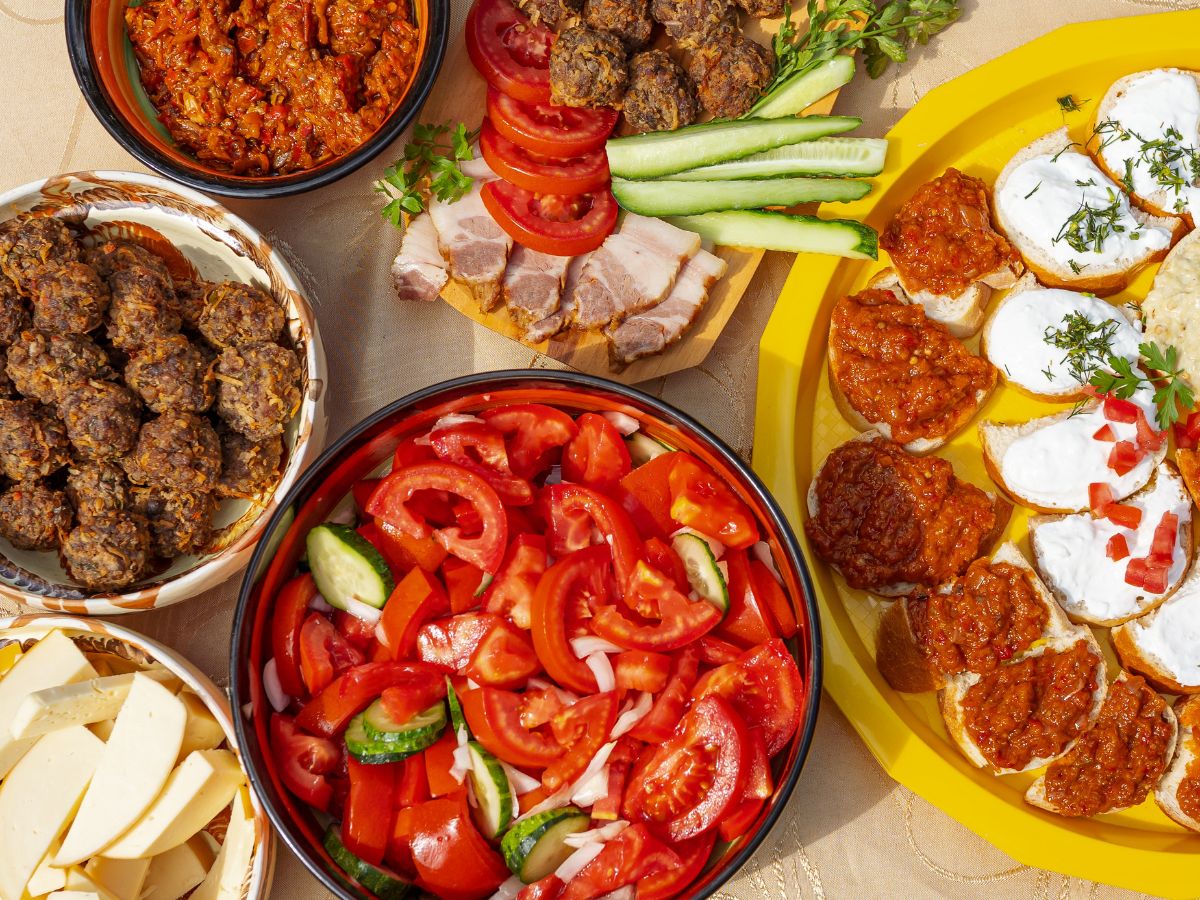 Plates filled with Romanian Cuisine as local brunch dishes in Transylvania