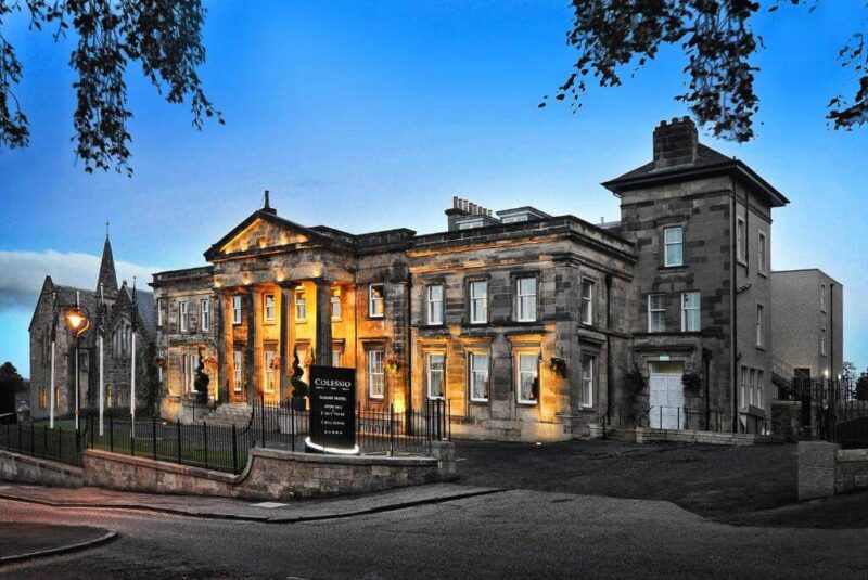 Outside Hotel Colessio, Victorian house at sunset