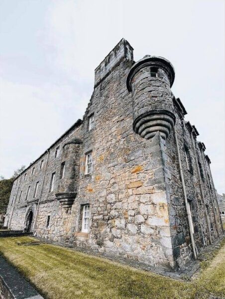 Exterior Menstrie Castel Castel gray stone facade on cloudy day