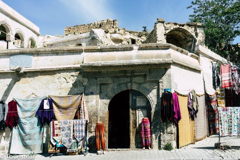 Old shop with colored clothes outside