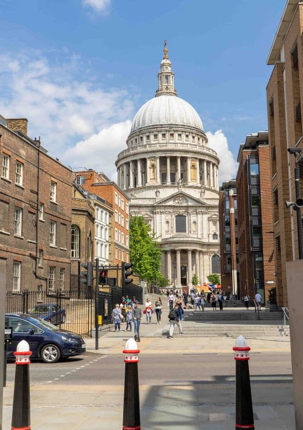 people in the street with St Paul church at the background