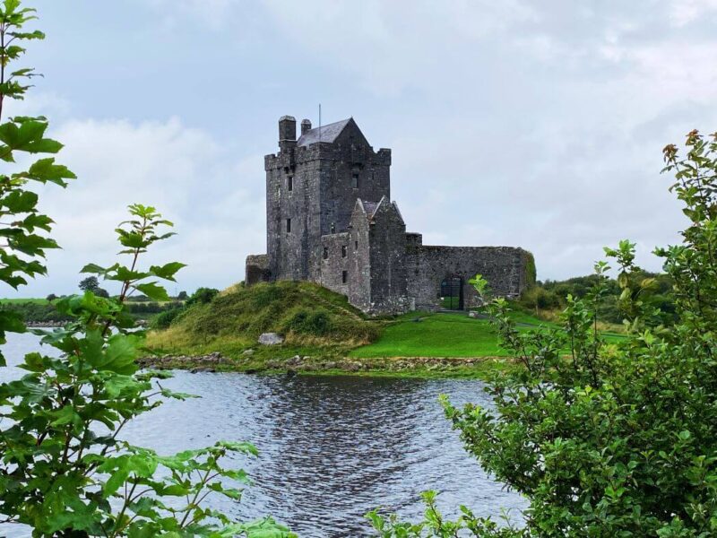 Dunguaire Castle with brith green lush